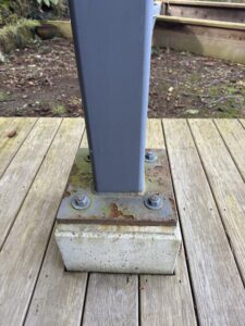 Rust on a post base