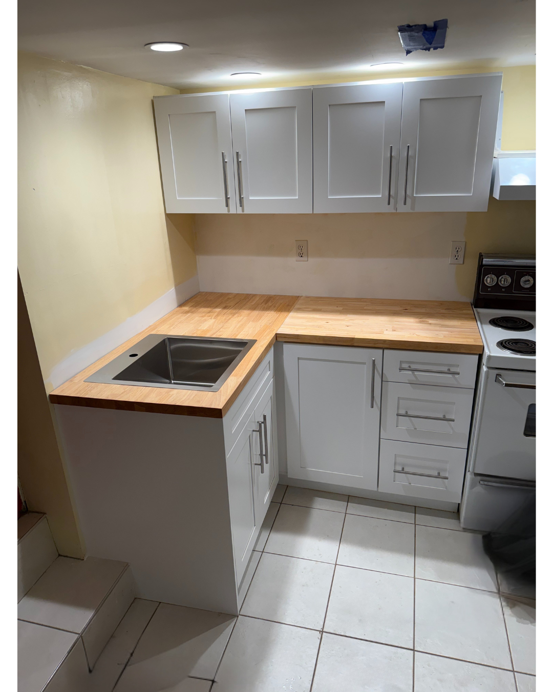 How To Do A Holiday Kitchen Renovation: Cabinet Removal, Wall Repair, and Butcher Block Countertop Installation in East Vancouver